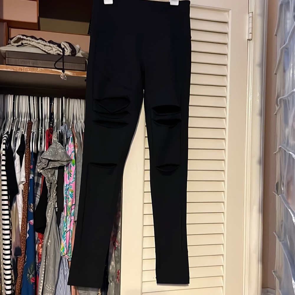 Zella live in leggings with holes in front.